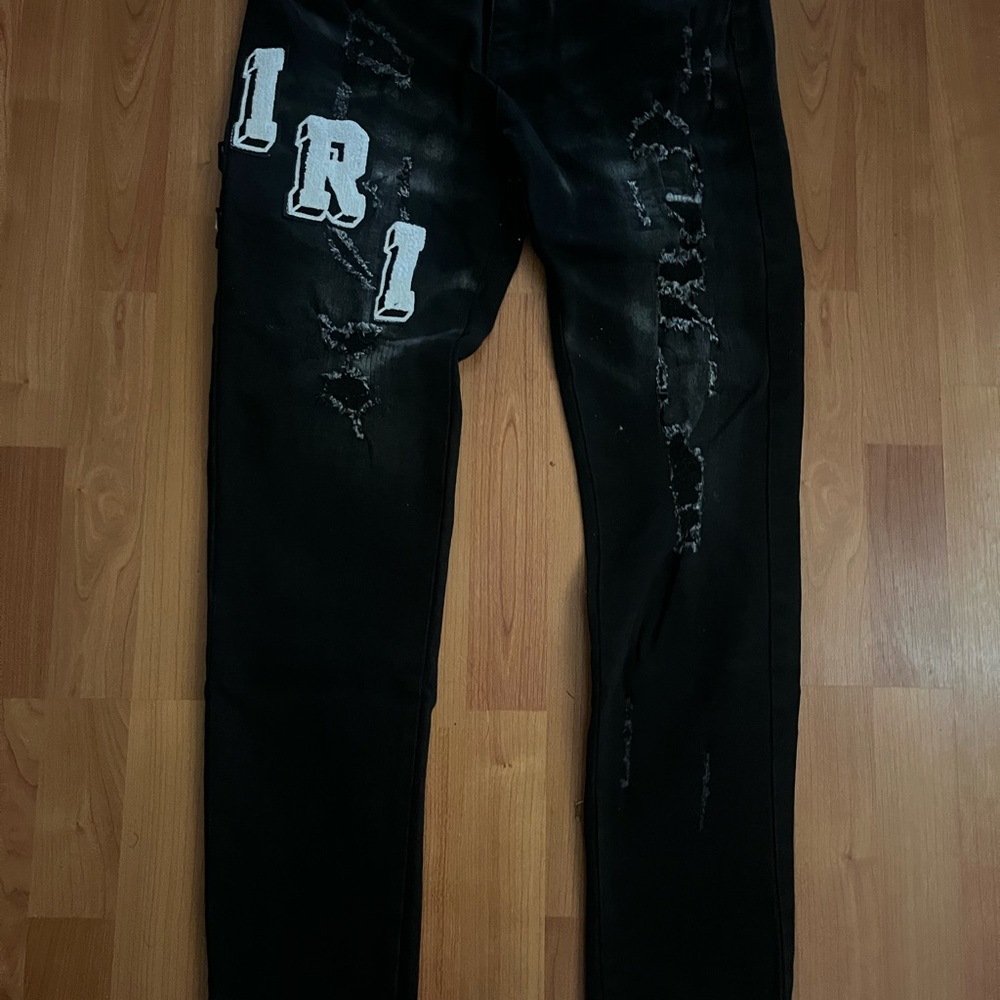 AMIRI Black Distressed Skinny Jeans with White Lettering